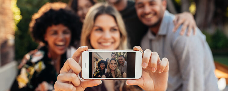 Group of people at event taking a selfie